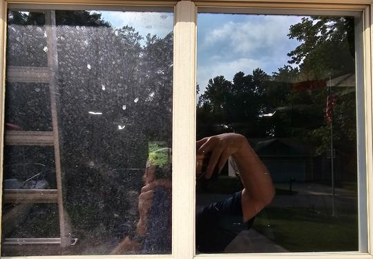 before and after of dirty garage pane